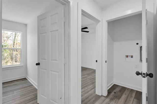 a bathroom with a granite countertop sink mirror vanity and toilet