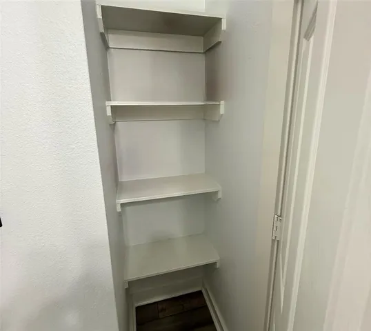 a view of an empty walk in closet