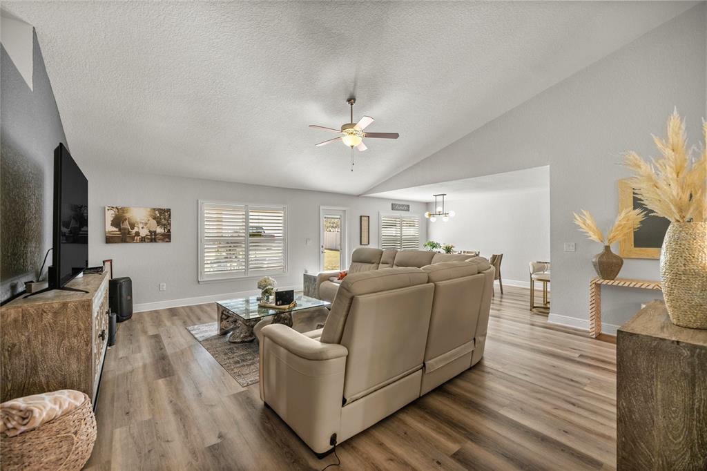 4160 Southwest 100th Street Ocala, FL 34476 - Photo 14 of 42 a living room with furniture and a flat screen tv
