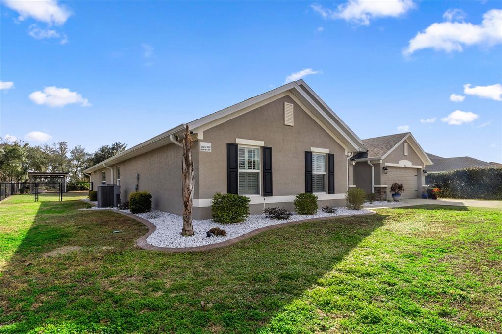 4160 Southwest 100th Street Ocala, FL 34476 - Photo 2 of 42 a view of a house with a yard and porch
