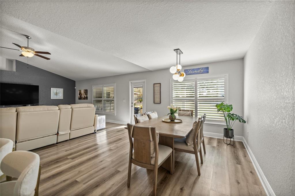 4160 Southwest 100th Street Ocala, FL 34476 - Photo 22 of 42 a view of a dining room with furniture window and wooden floor