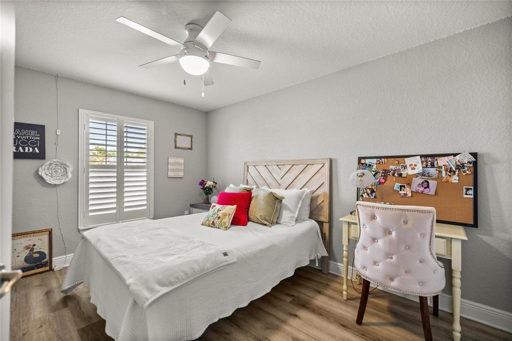 4160 Southwest 100th Street Ocala, FL 34476 - Photo 33 of 42 a bedroom with a bed and a table with chair
