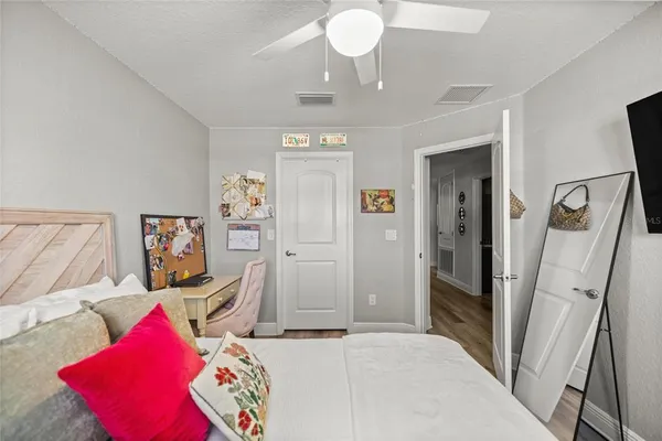 a view of a bedroom with bed and furniture