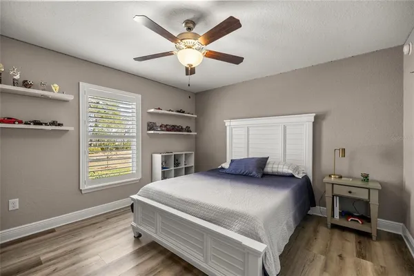 a bedroom with a large bed and a window