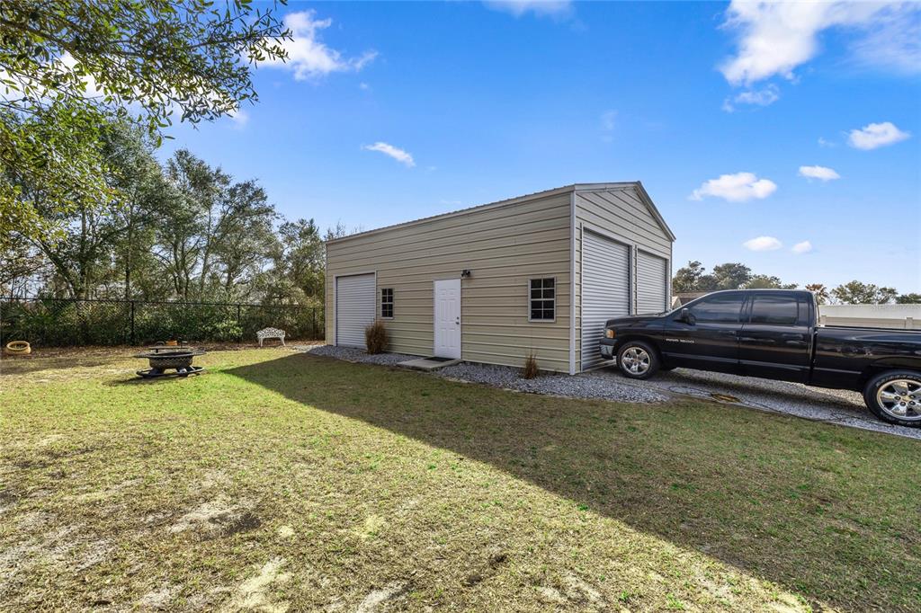 4160 Southwest 100th Street Ocala, FL 34476 - Photo 39 of 42 a view of a backyard with sitting area