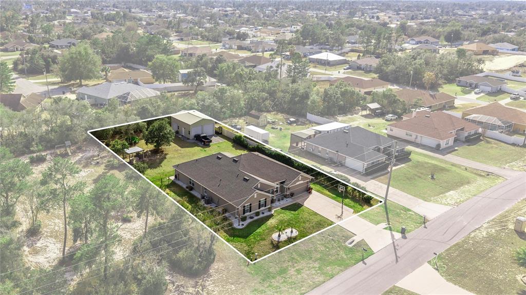 4160 Southwest 100th Street Ocala, FL 34476 - Photo 5 of 42 an aerial view of house with yard