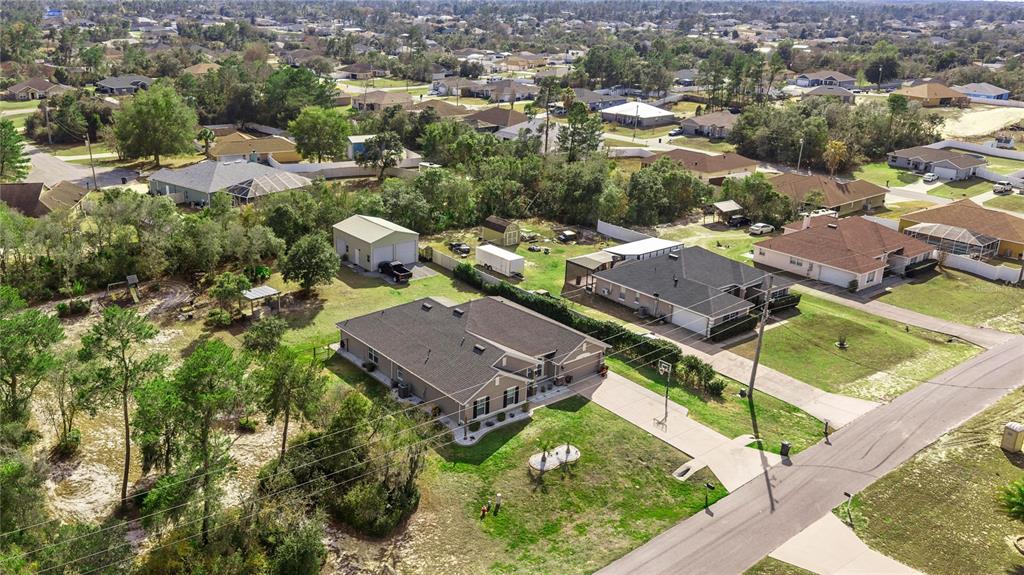 4160 Southwest 100th Street Ocala, FL 34476 - Photo 6 of 42 an aerial view of residential houses with outdoor space and street view