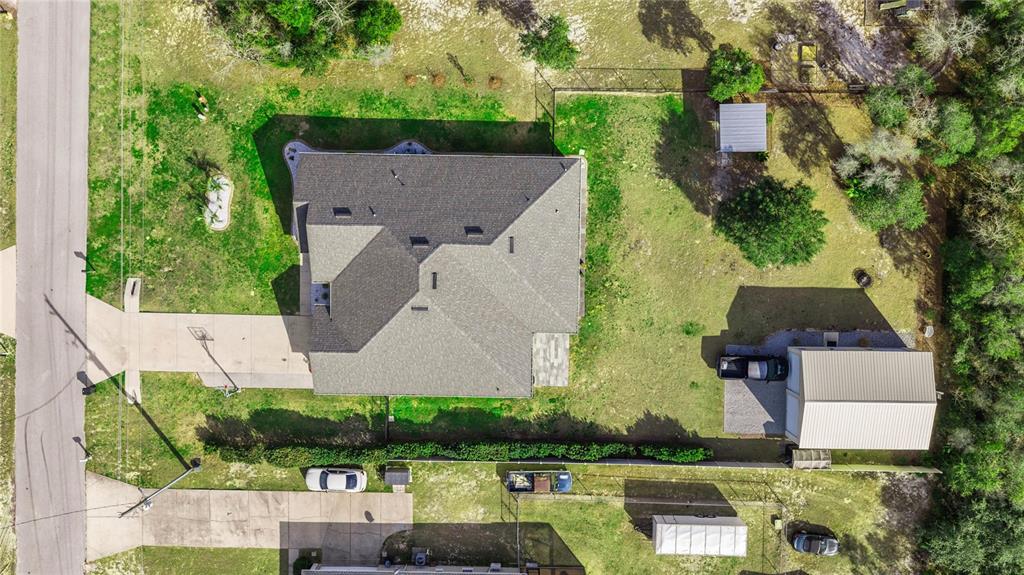 4160 Southwest 100th Street Ocala, FL 34476 - Photo 8 of 42 an aerial view of a house with yard swimming pool and outdoor seating