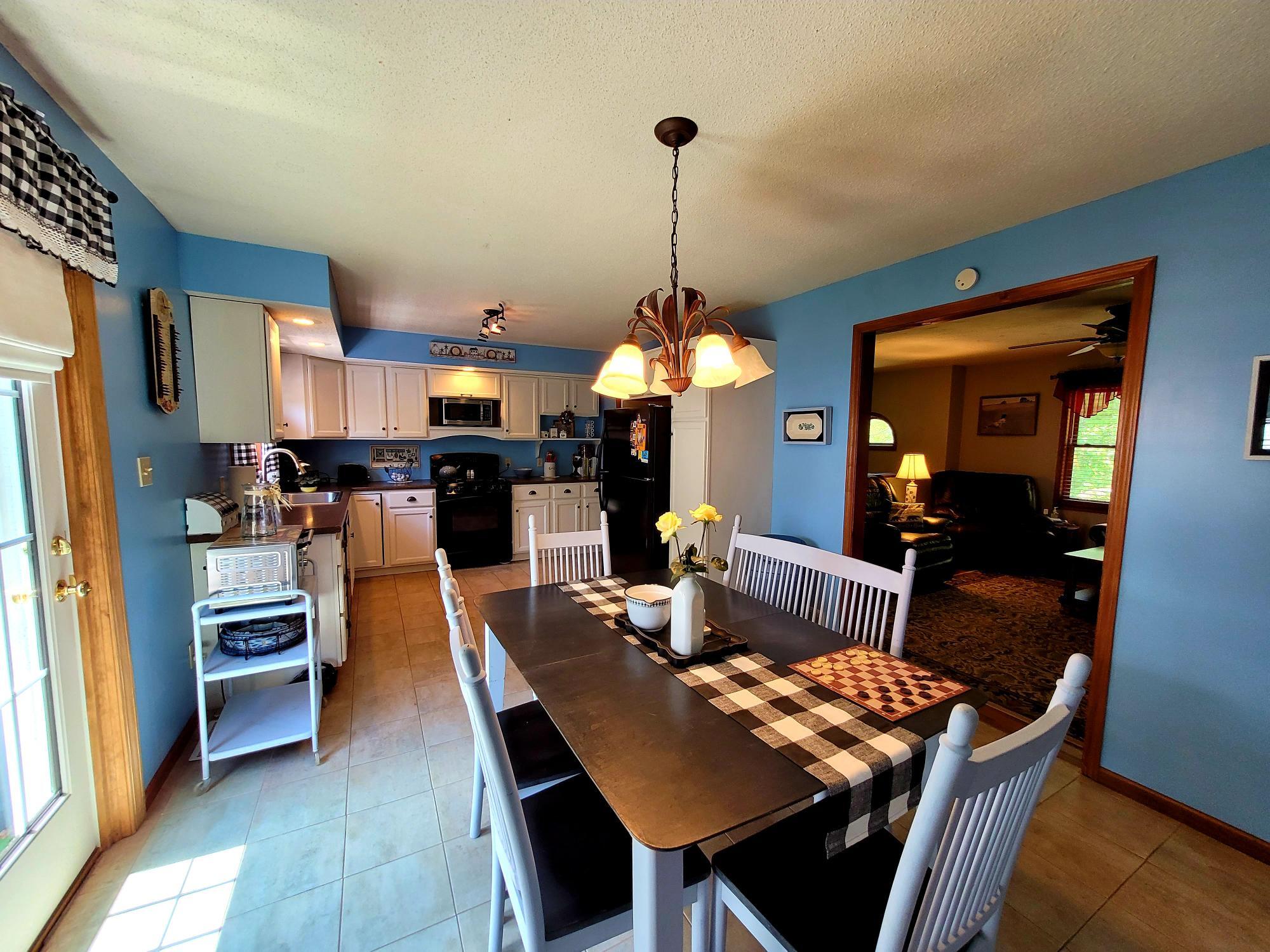 290 Penney Road Belgrade, ME 04917 - Photo 11 of 50 11 Dining area looking into living room