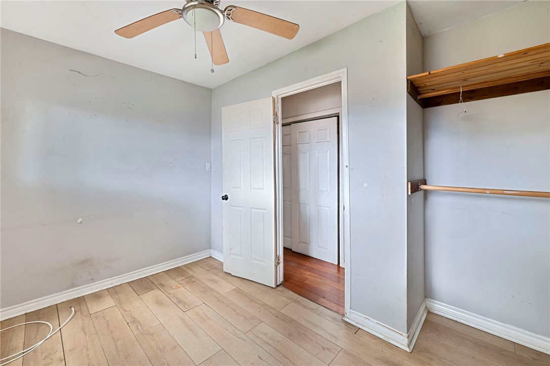 15364 Naranja Avenue Paramount, CA 90723 - Photo 13 of 28 an empty room with wooden floor closet and windows