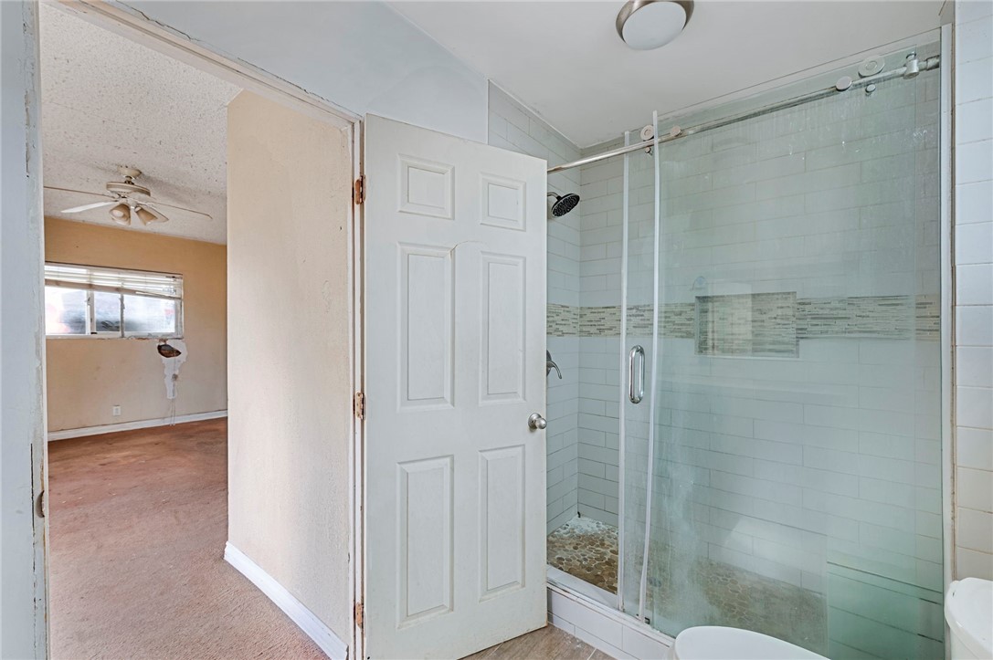 15364 Naranja Avenue Paramount, CA 90723 - Photo 21 of 28 a bathroom with a shower and toilet