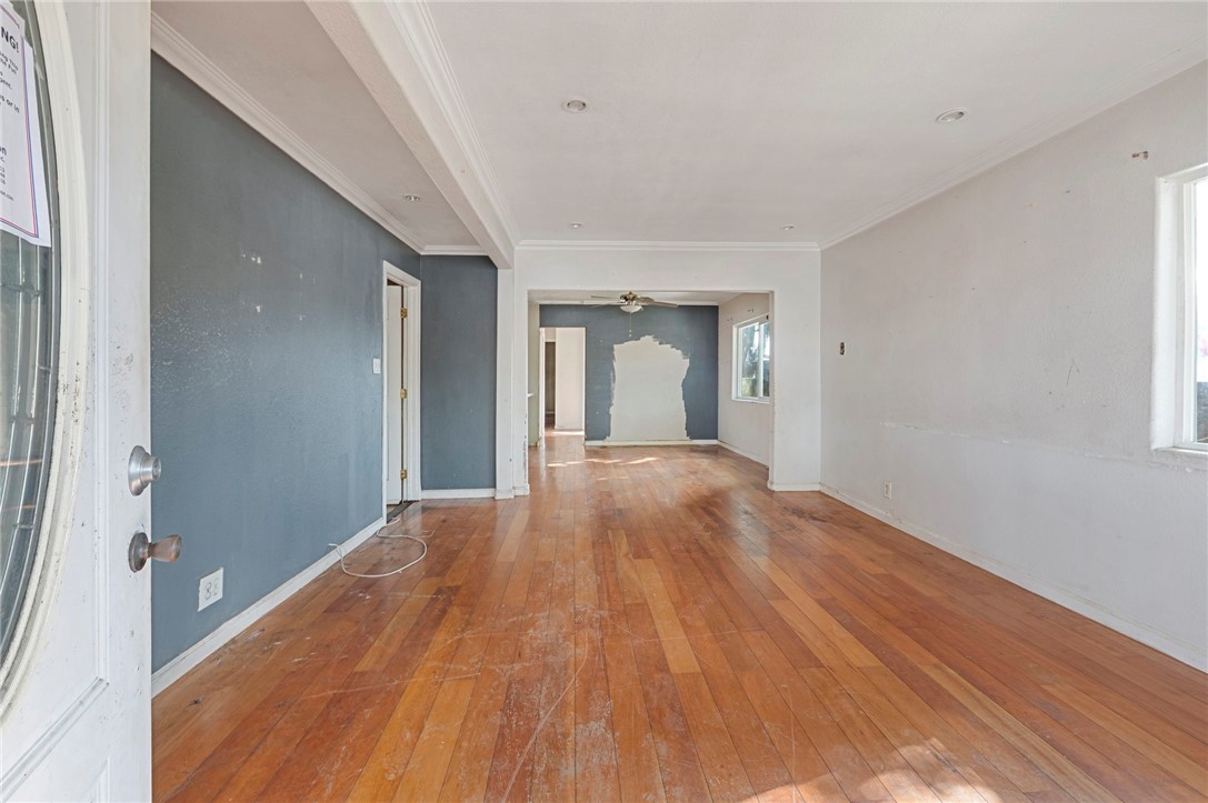 15364 Naranja Avenue Paramount, CA 90723 - Photo 3 of 28 a view of a big room with wooden floor and windows