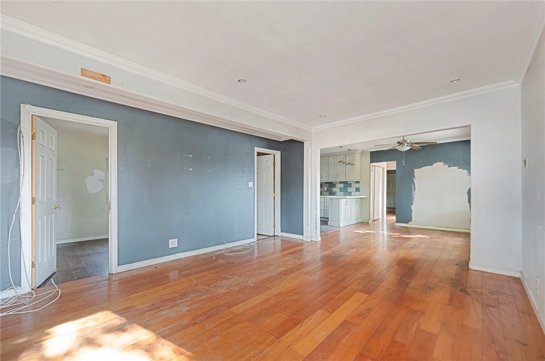 15364 Naranja Avenue Paramount, CA 90723 - Photo 4 of 28 a view of an empty room with wooden floor and a window