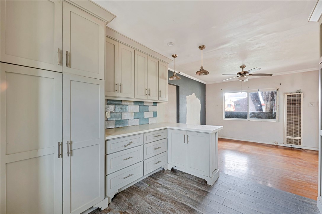 15364 Naranja Avenue Paramount, CA 90723 - Photo 8 of 28 a kitchen with granite countertop white cabinets and white appliances