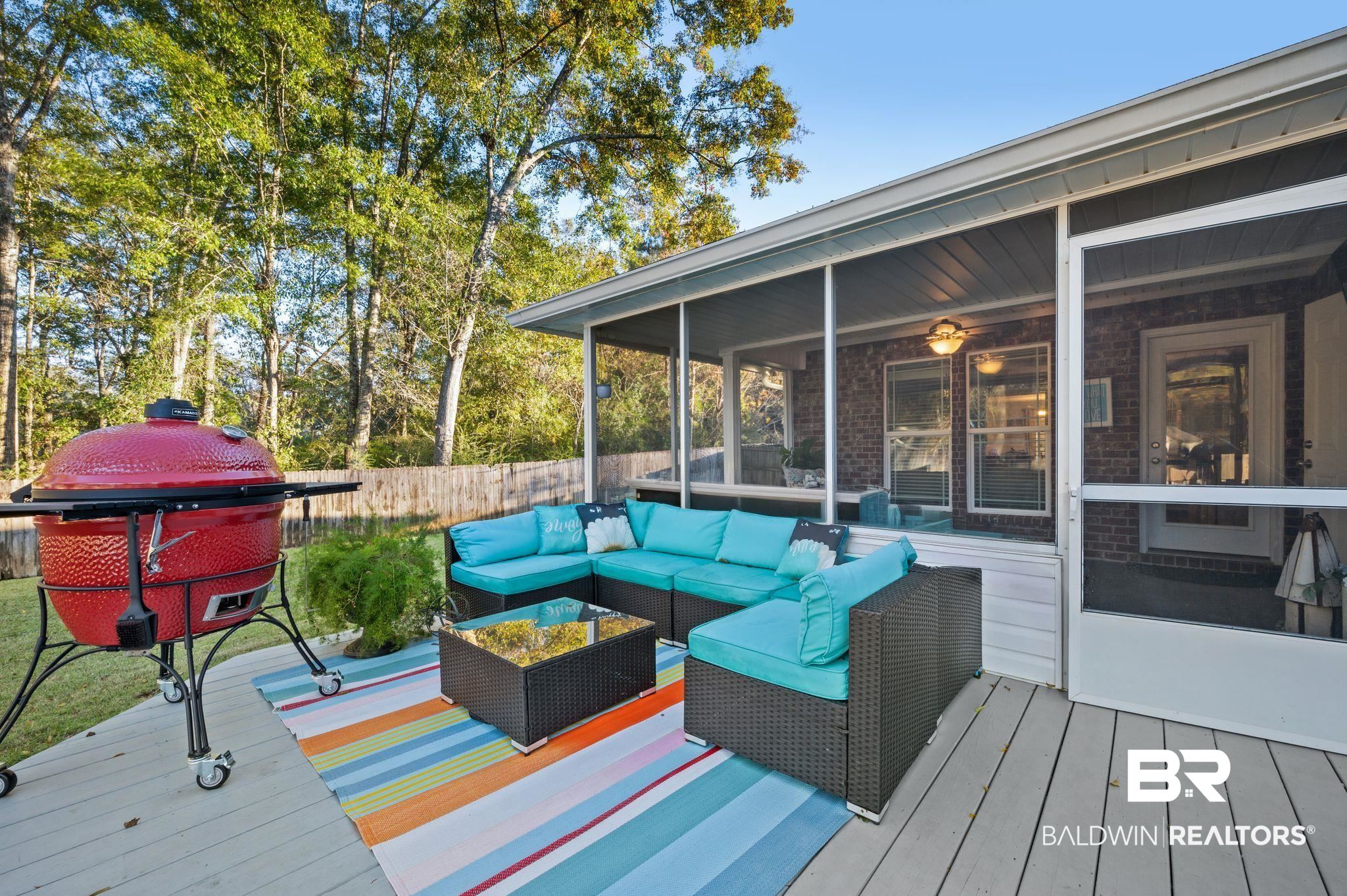 9366 Fox Run Court Semmes, AL 36575 - Photo 22 of 29 Wooden deck featuring outdoor lounge area and a sunroom