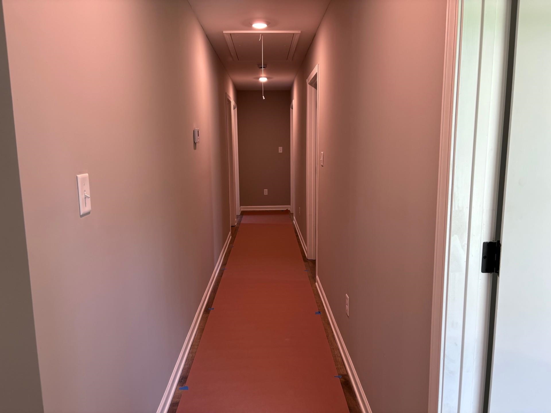 3701 Whittier Road Memphis, TN 38108 - Photo 10 of 13 Corridor with attic access and baseboards