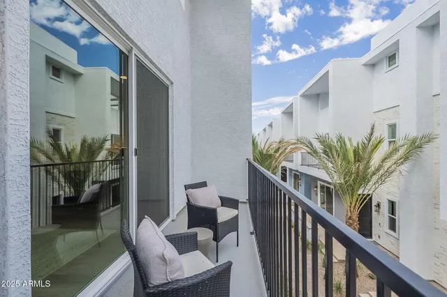 a view of balcony with furniture