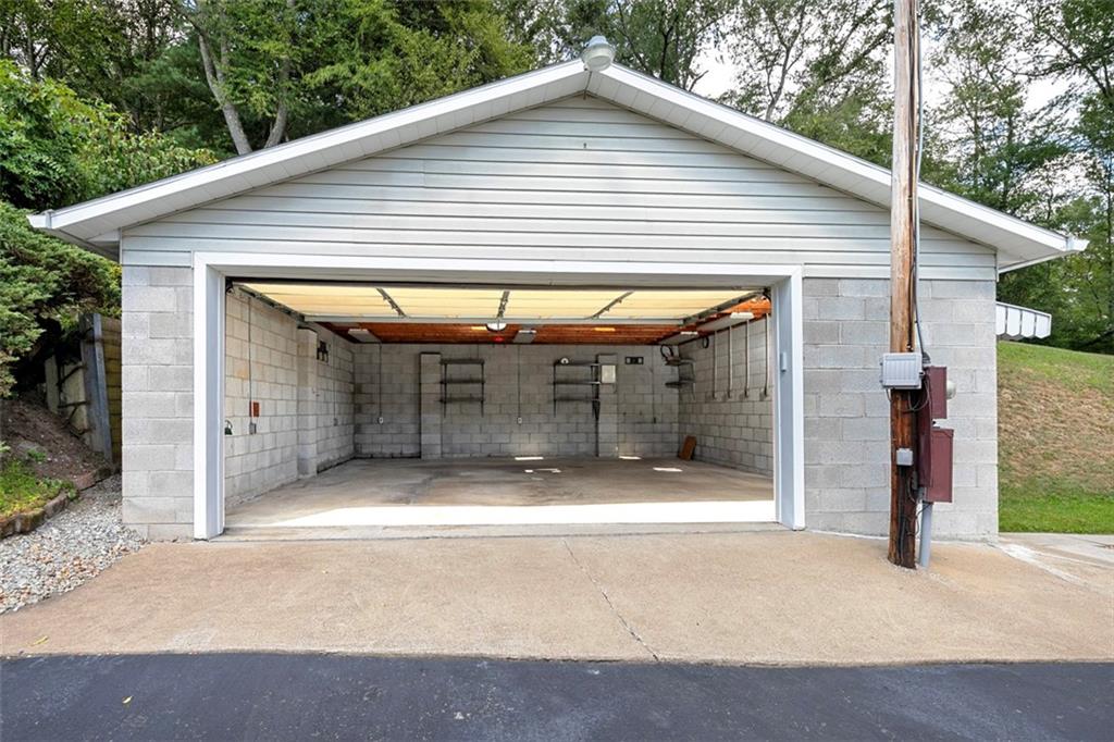 1017 Nellie Road Vanderbilt, PA 15486 - Photo 11 of 31 a view of a house with a garage and yard