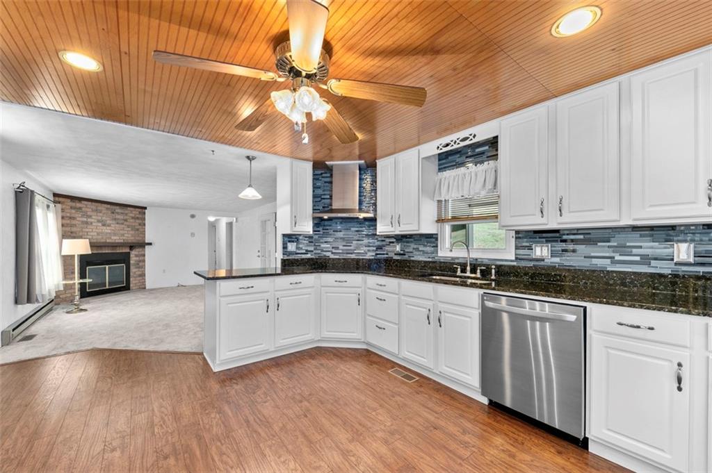 1017 Nellie Road Vanderbilt, PA 15486 - Photo 15 of 31 a large kitchen with cabinets and wooden floor