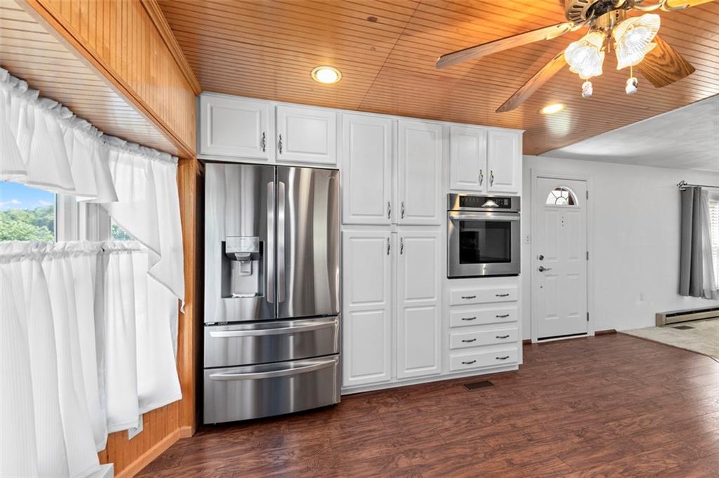 1017 Nellie Road Vanderbilt, PA 15486 - Photo 16 of 31 a kitchen with stainless steel appliances a refrigerator and a stove top oven