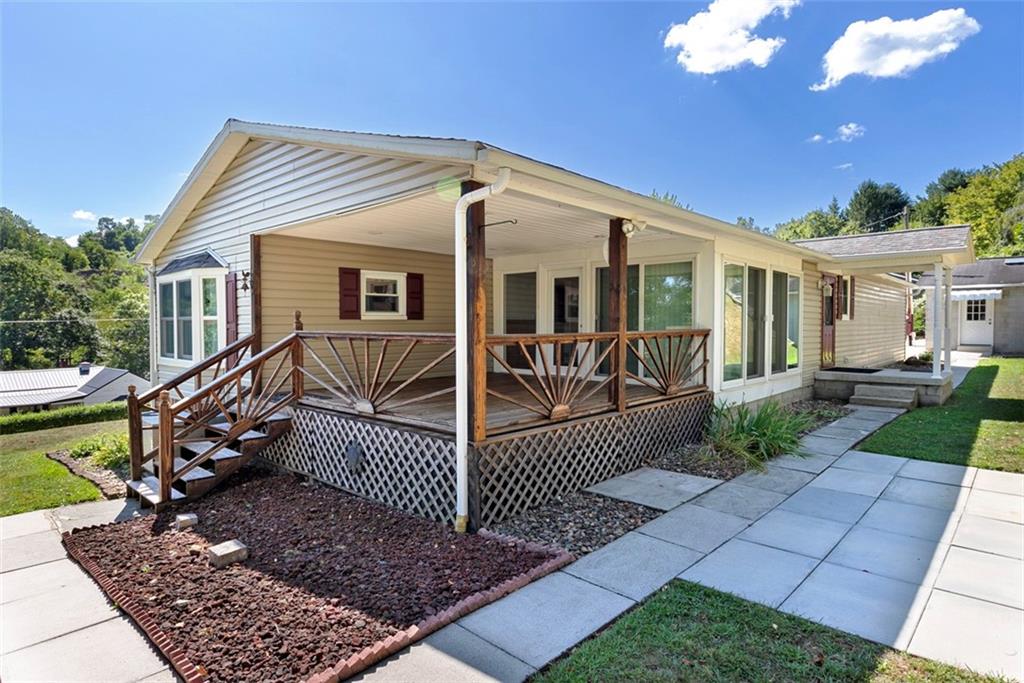 1017 Nellie Road Vanderbilt, PA 15486 - Photo 4 of 31 a view of a house with a small yard and wooden fence