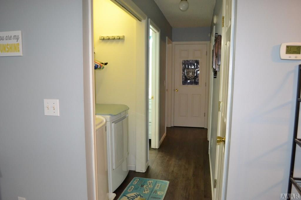 391 Country Club Road Camden, NC 27921 - Photo 13 of 42 hallway with laundry closet
