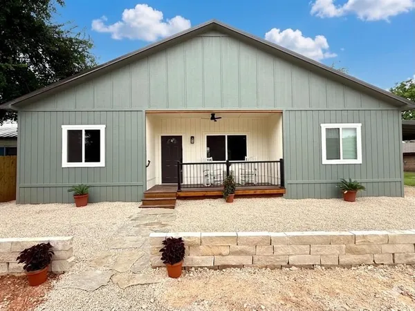 a front view of a house with a patio