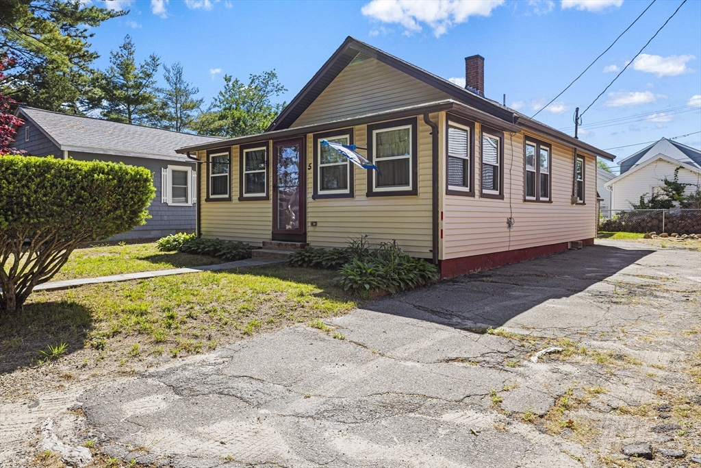 5 Meade Street Wareham, MA 02571 - Photo 1 of 21 a front view of a house with a yard
