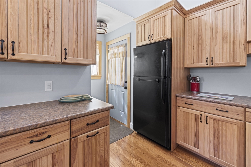 5 Meade Street Wareham, MA 02571 - Photo 11 of 21 a kitchen with stainless steel appliances granite countertop a refrigerator and cabinets