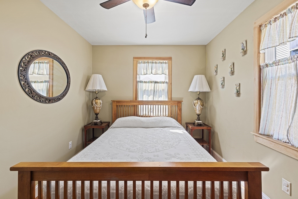 5 Meade Street Wareham, MA 02571 - Photo 12 of 21 a bed sitting in a bedroom next to a window