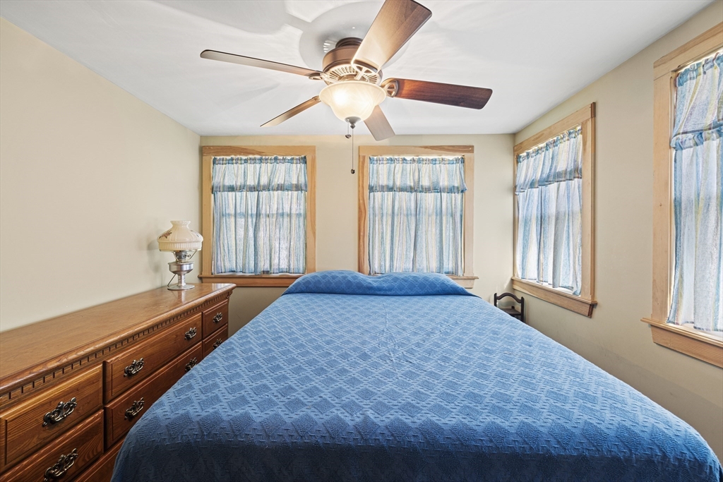5 Meade Street Wareham, MA 02571 - Photo 14 of 21 a bedroom with a bed and a window