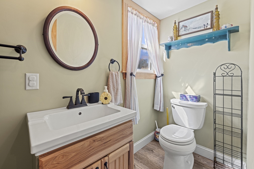 5 Meade Street Wareham, MA 02571 - Photo 18 of 21 a bathroom with a sink vanity mirror and toilet
