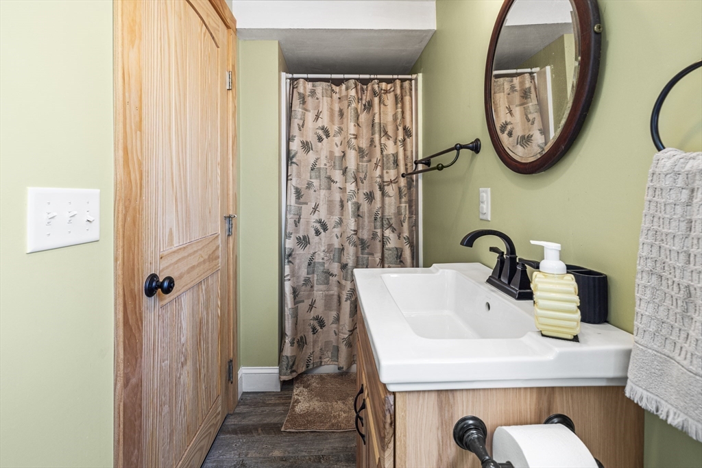 5 Meade Street Wareham, MA 02571 - Photo 19 of 21 a bathroom with a sink and a mirror
