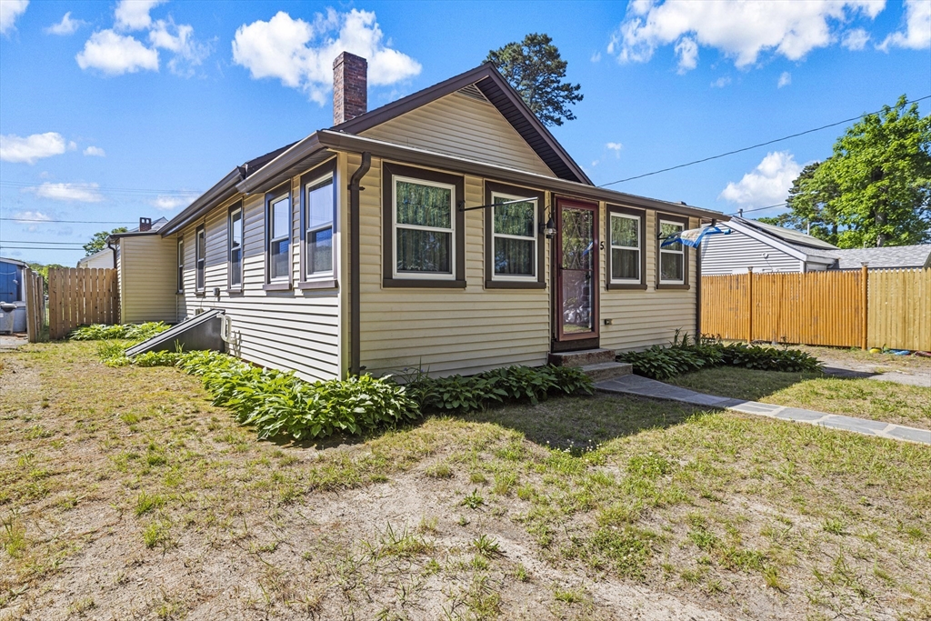 5 Meade Street Wareham, MA 02571 - Photo 2 of 21 a front view of a house with garden