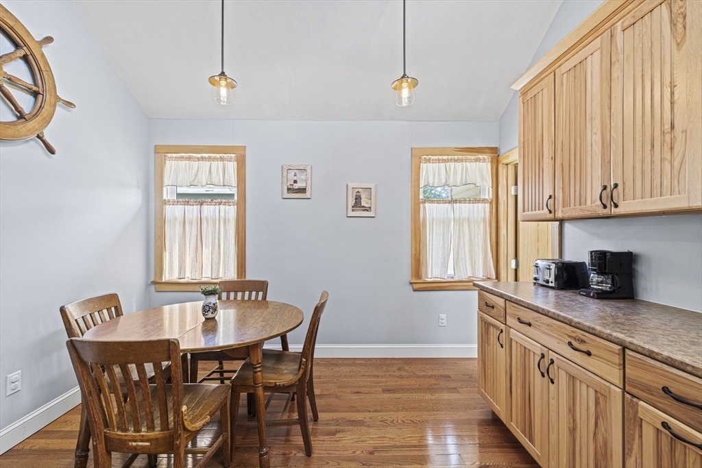 5 Meade Street Wareham, MA 02571 - Photo 8 of 21 a kitchen with stainless steel appliances a table and chairs