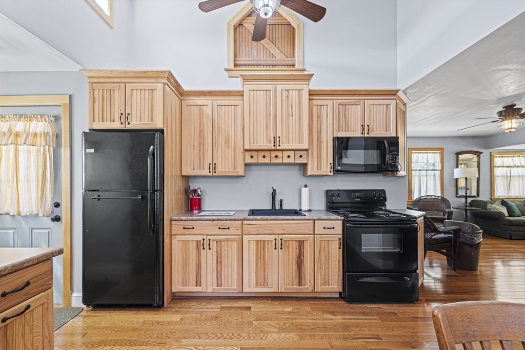 5 Meade Street Wareham, MA 02571 - Photo 10 of 21 a kitchen with stainless steel appliances granite countertop a refrigerator stove top oven and sink