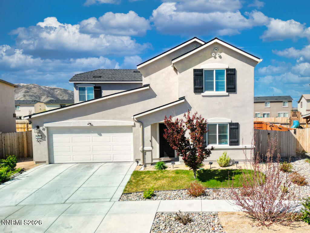 8957 Buffalo Grove Drive Reno, NV 89506 - Photo 1 of 59 a front view of a house with garden
