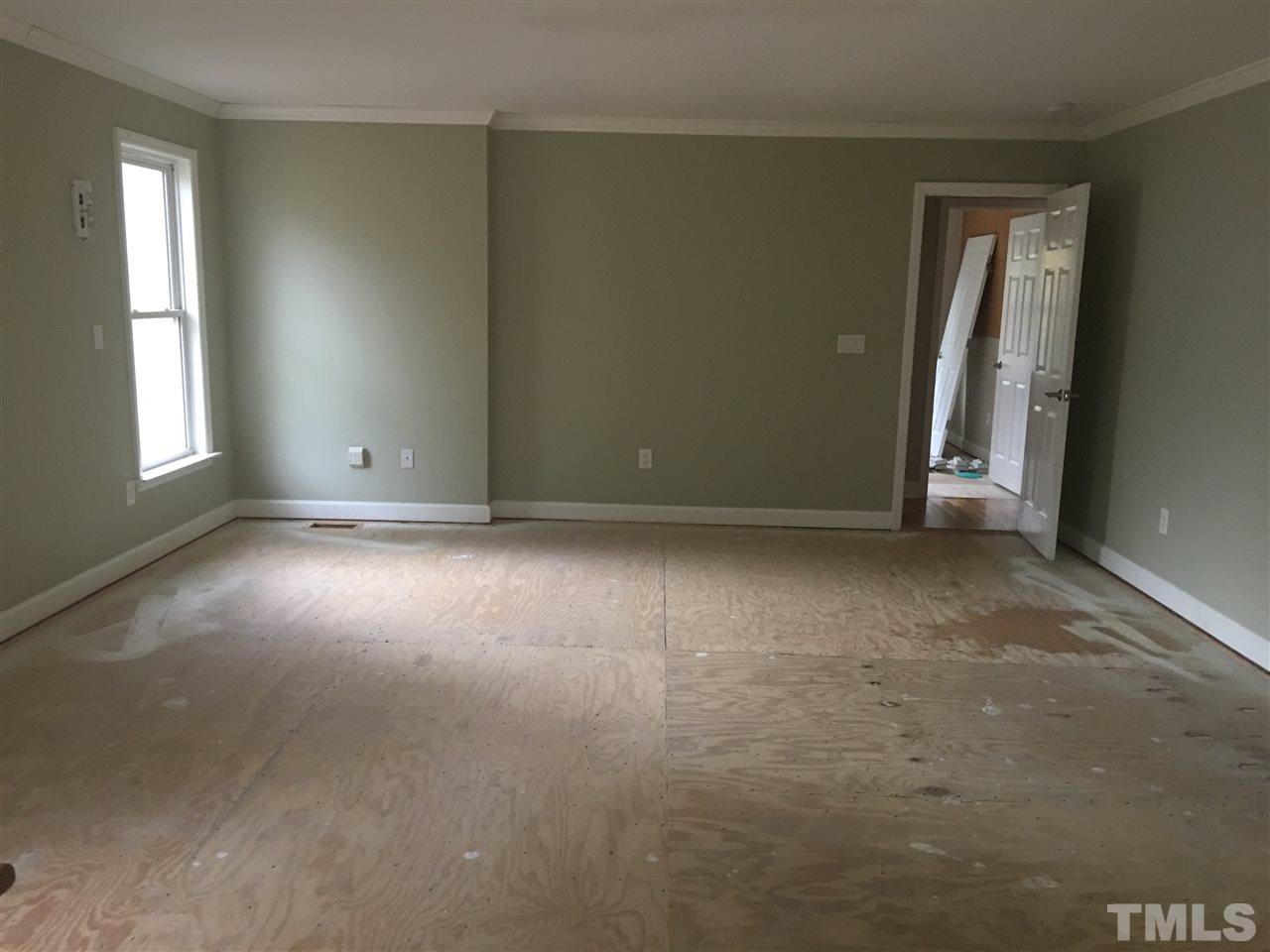1425 Goodwin Road Apex, NC 27523 - Photo 13 of 23 an empty room with windows