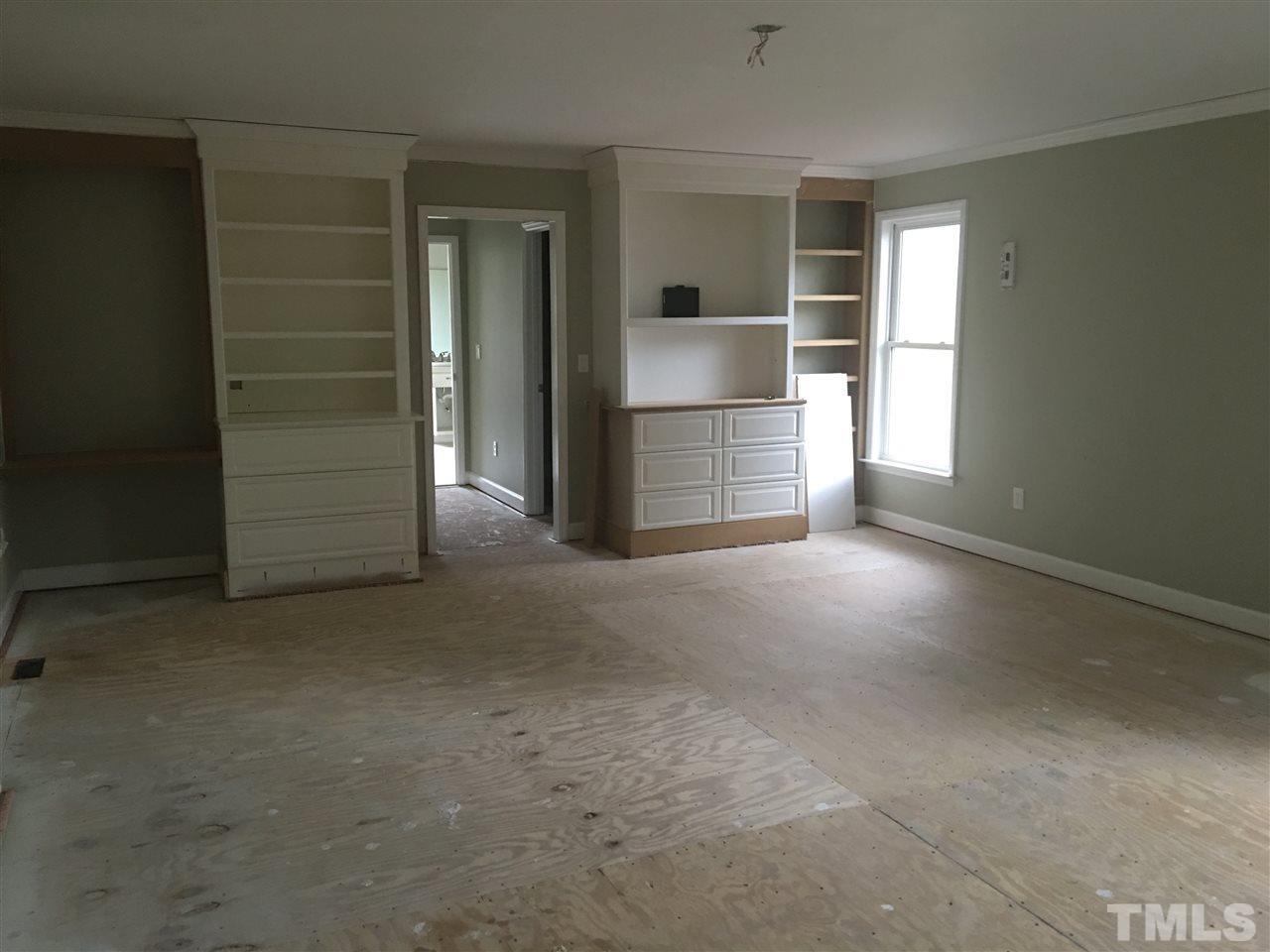 1425 Goodwin Road Apex, NC 27523 - Photo 14 of 23 an empty room with closet and en suite bathroom