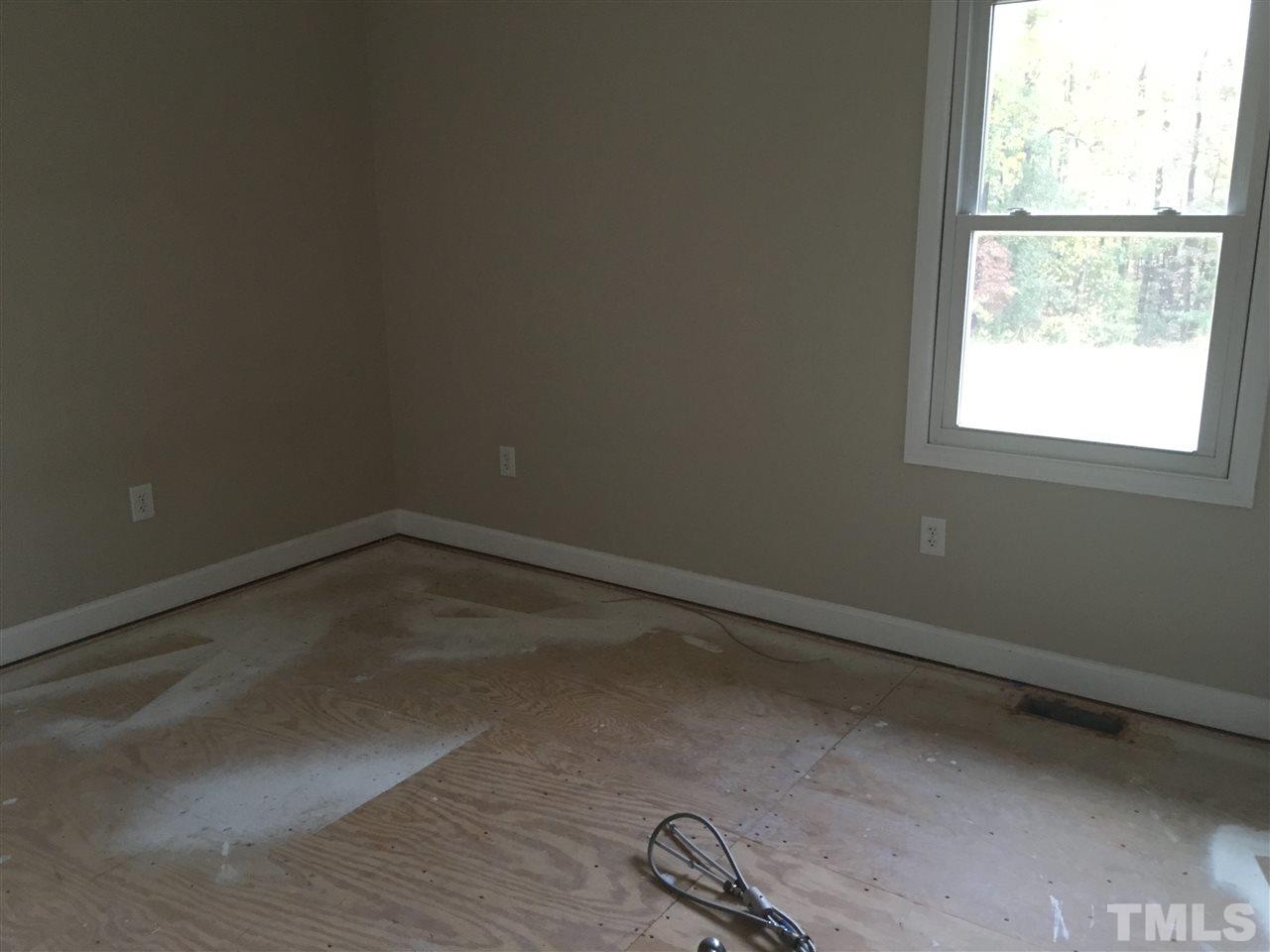 1425 Goodwin Road Apex, NC 27523 - Photo 16 of 23 an empty room with a window
