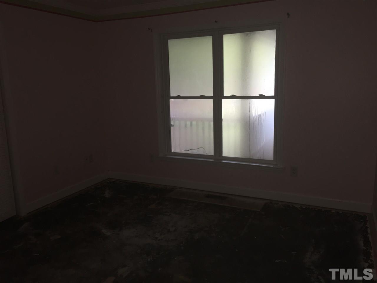 1425 Goodwin Road Apex, NC 27523 - Photo 17 of 23 a view of an empty room with a window