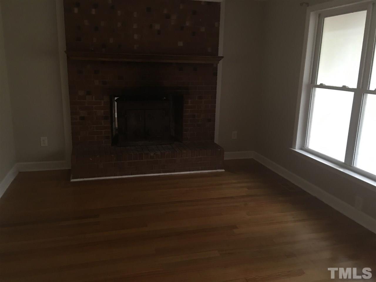 1425 Goodwin Road Apex, NC 27523 - Photo 3 of 23 a room with wooden floor and a window