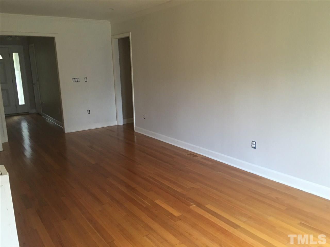 1425 Goodwin Road Apex, NC 27523 - Photo 9 of 23 a view of a room with wooden floor