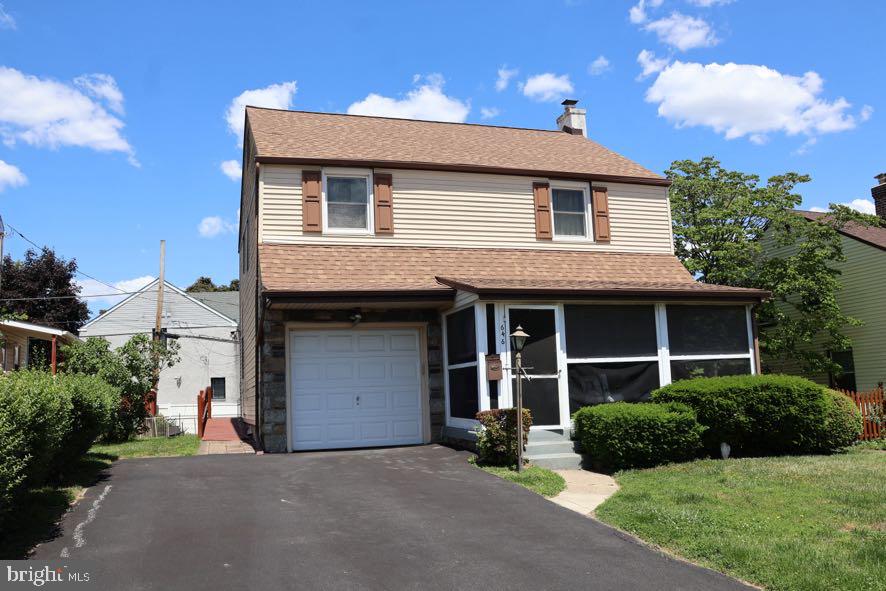 Charming two-story home with yard.