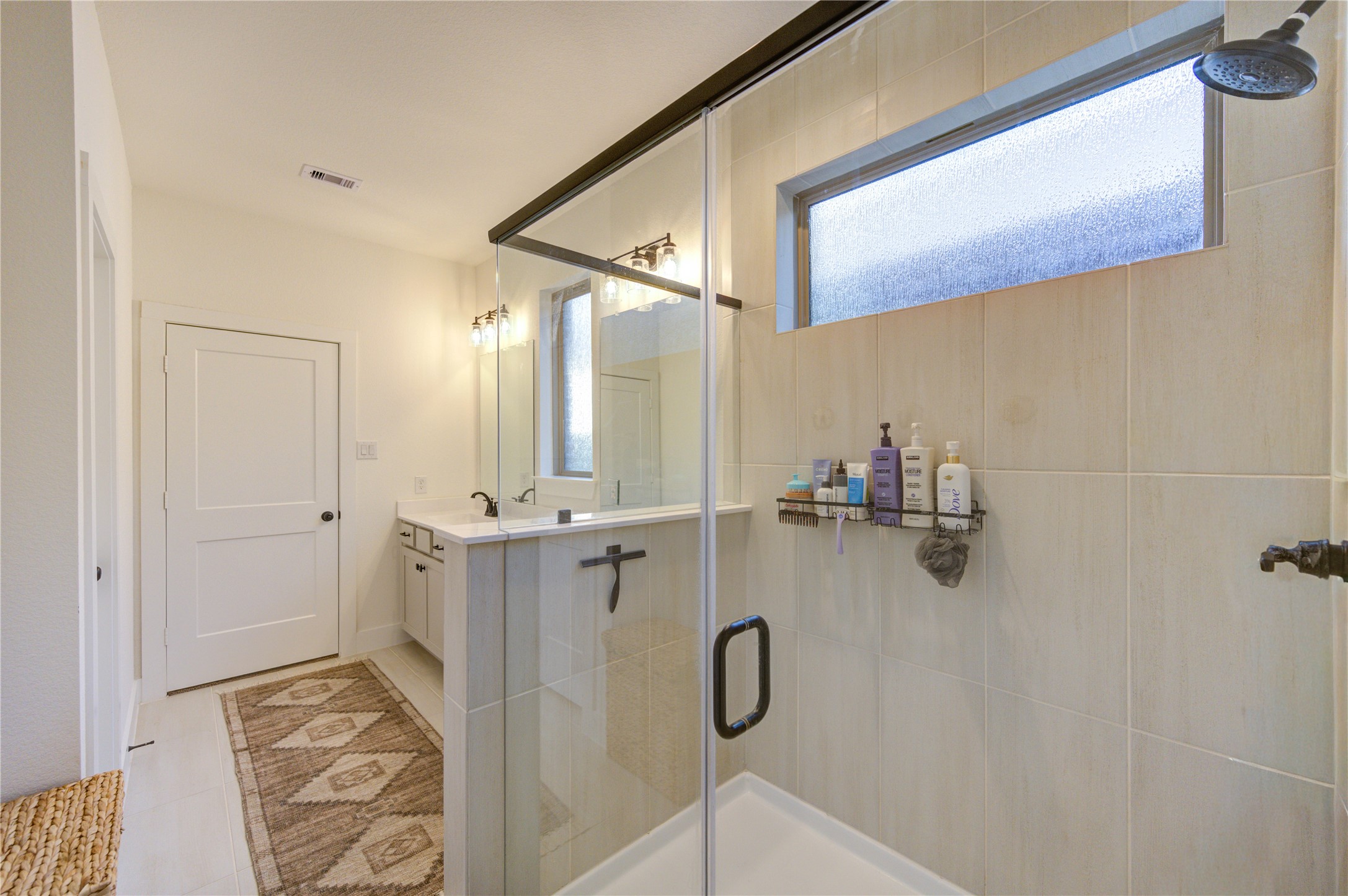 17758 Tree Of Heaven Conroe, TX 77385 - Photo 23 of 44 a bathroom with a shower and a sink