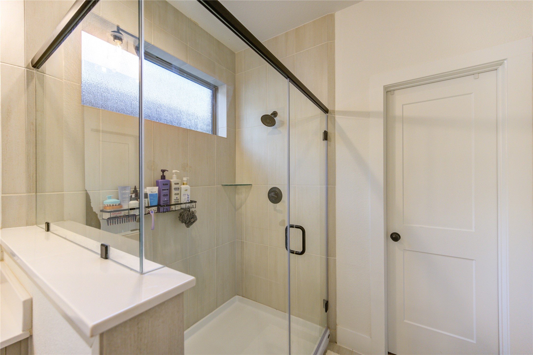 17758 Tree Of Heaven Conroe, TX 77385 - Photo 24 of 44 a bathroom with a sink and mirror with toilet