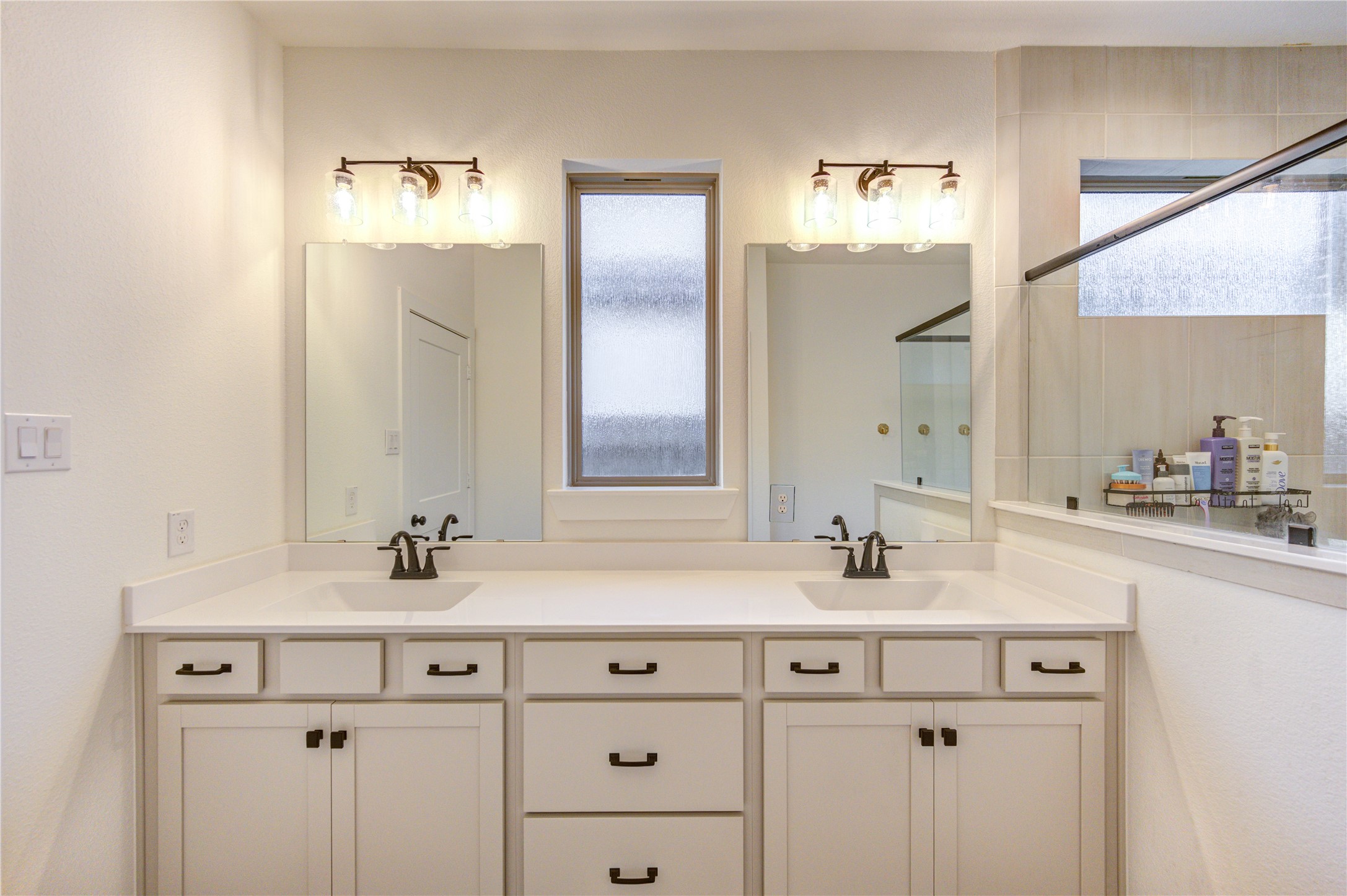 17758 Tree Of Heaven Conroe, TX 77385 - Photo 26 of 44 a bathroom with double sink and two mirror