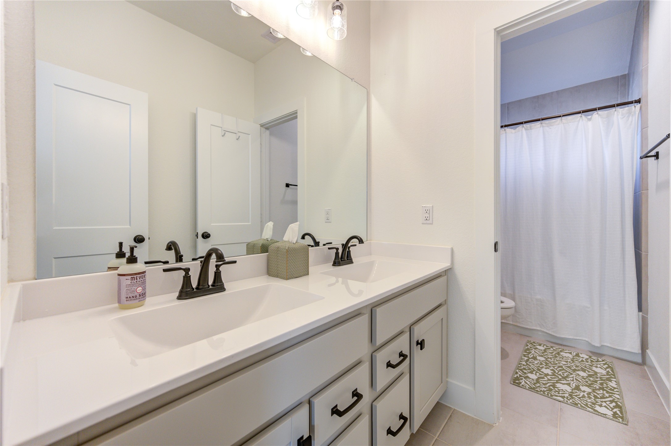 17758 Tree Of Heaven Conroe, TX 77385 - Photo 32 of 44 a bathroom with a sink and a mirror