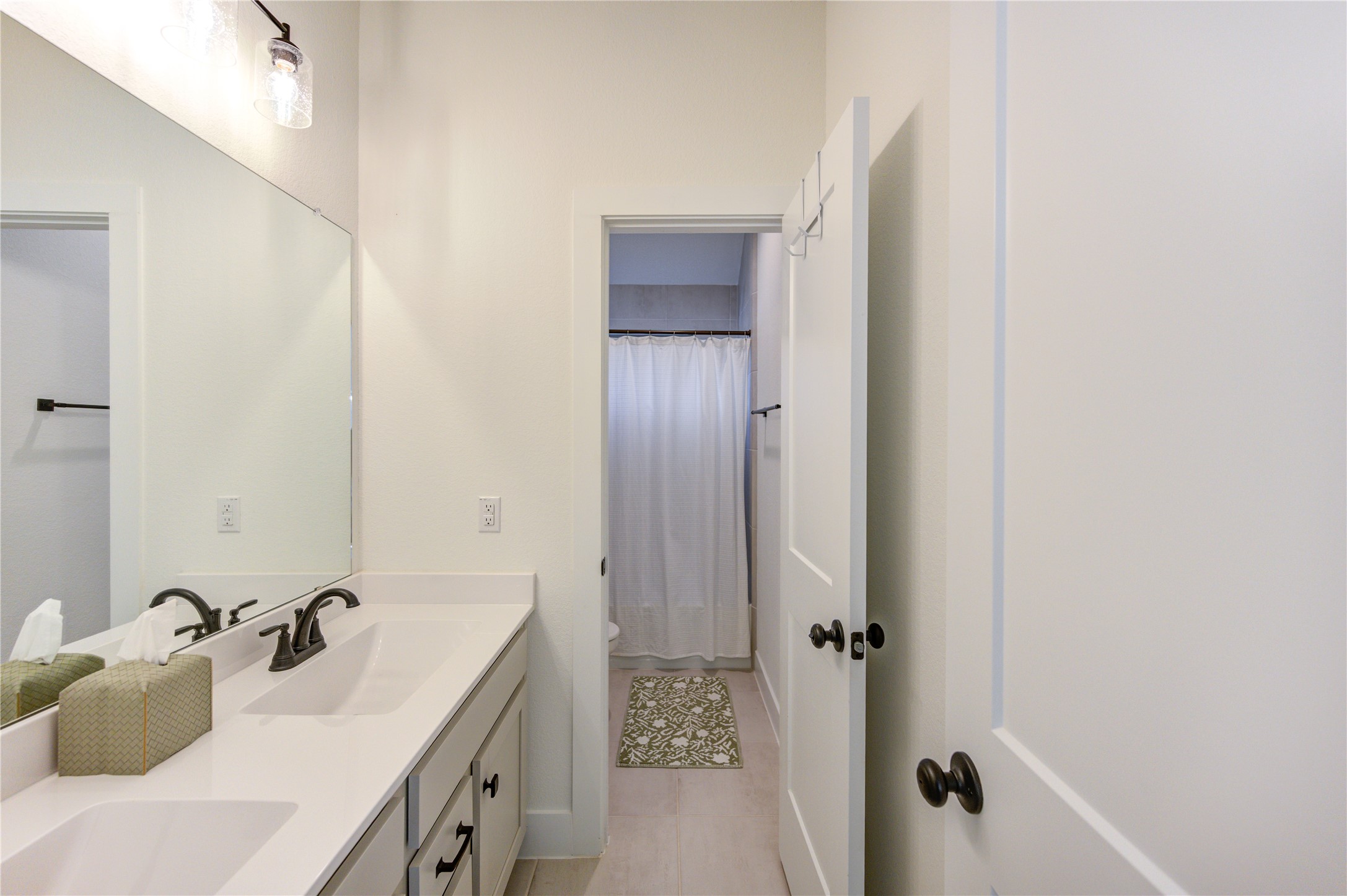 17758 Tree Of Heaven Conroe, TX 77385 - Photo 33 of 44 a bathroom with a tub sink and mirror