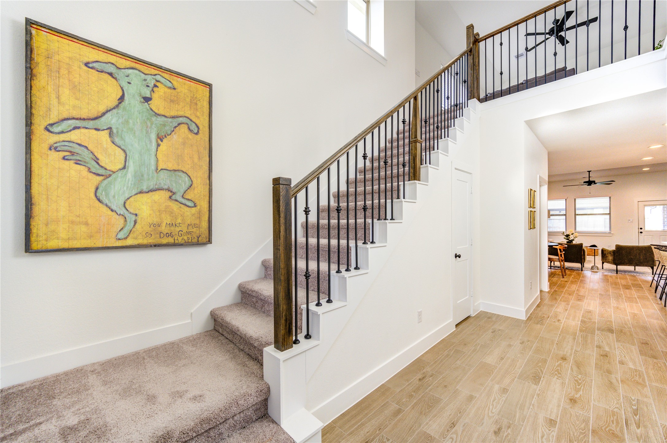 17758 Tree Of Heaven Conroe, TX 77385 - Photo 4 of 44 a view of a hallway with wooden floor and stairs